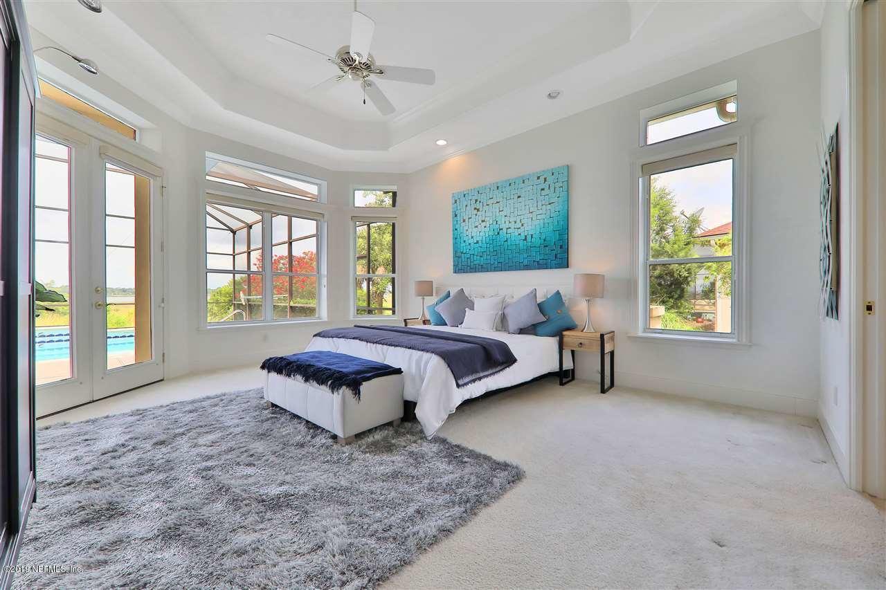 320 View Point Place St. Augustine, FL 32080 - Photo 2 of 33 a spacious bedroom with a bed and a couch