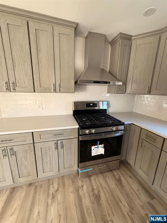 545 Lexington Avenue Clifton, NJ 07011 - Photo 3 of 15 a kitchen with a sink and wooden floor