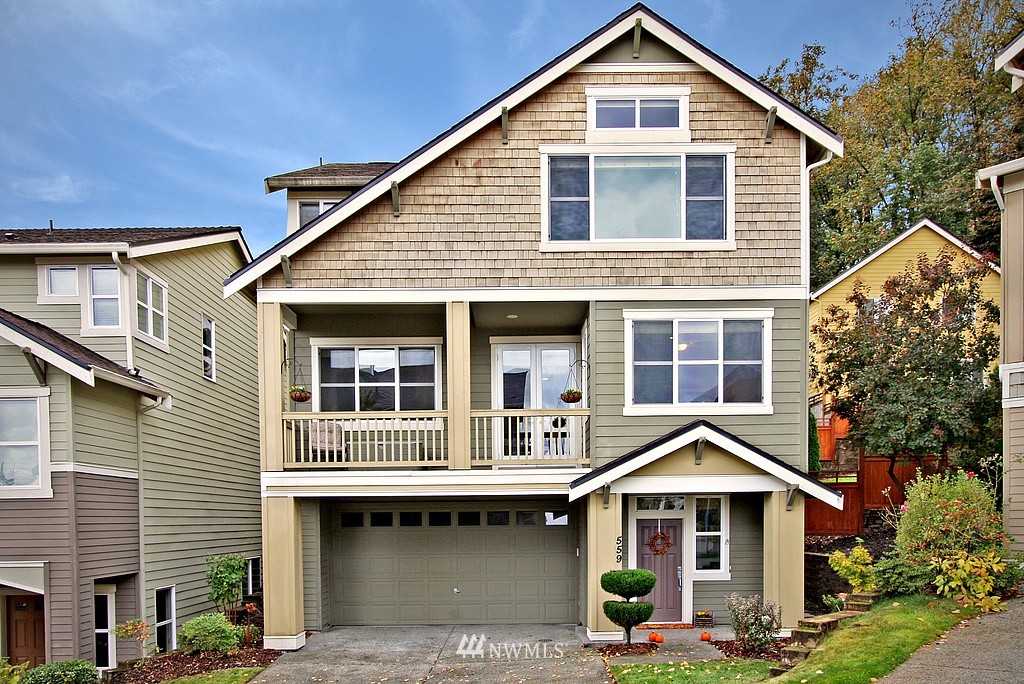 559 Alpine Ridge Place Northwest Issaquah, WA 98027 - Photo 1 of 15 a front view of a house with yard