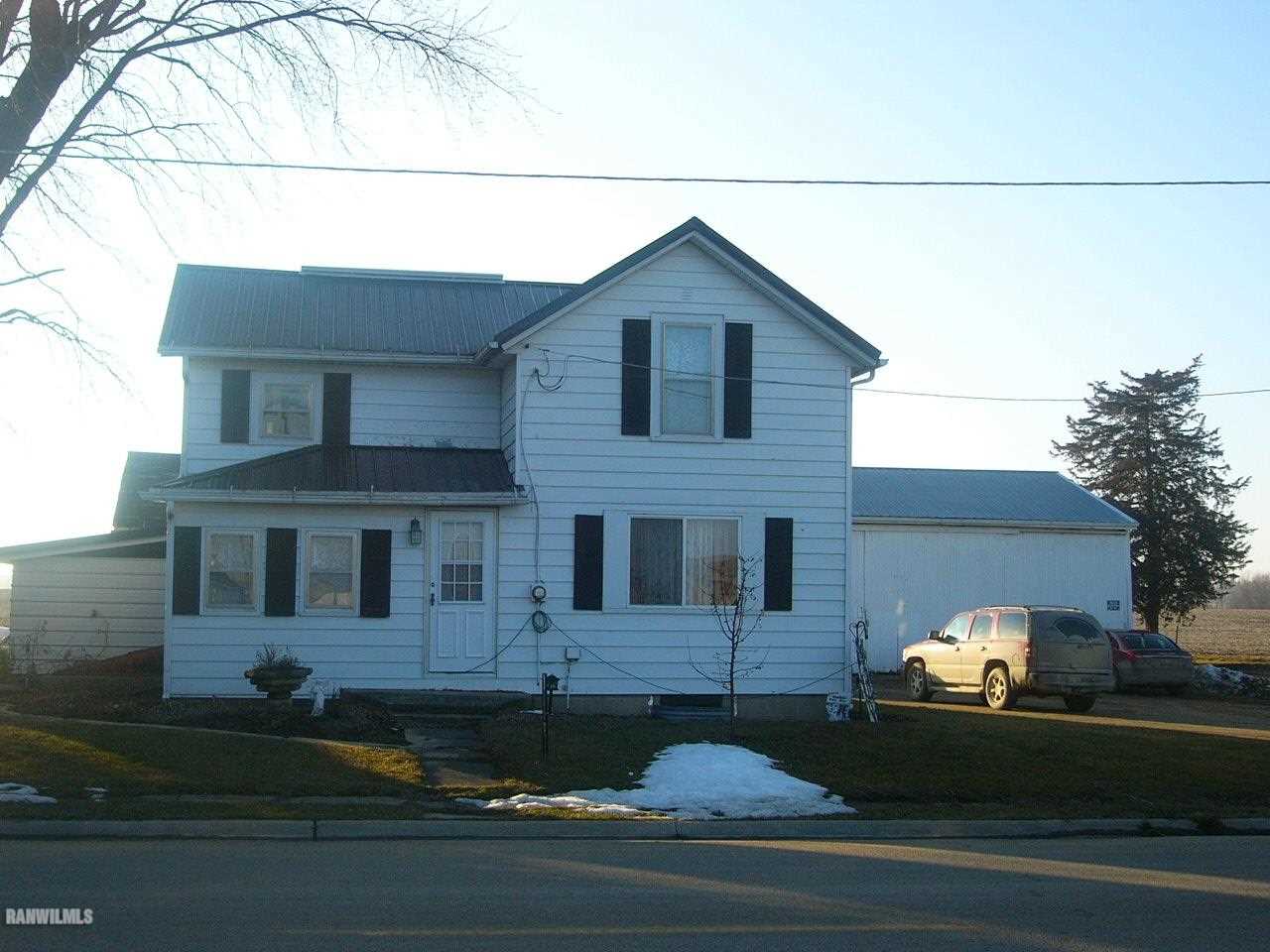 a front view of a house with garage