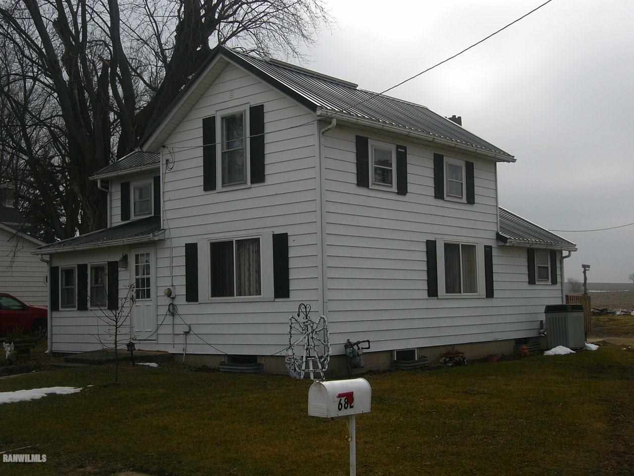 682 North Kent Road Kent, IL 61044 - Photo 11 of 13 a front view of a house with garden