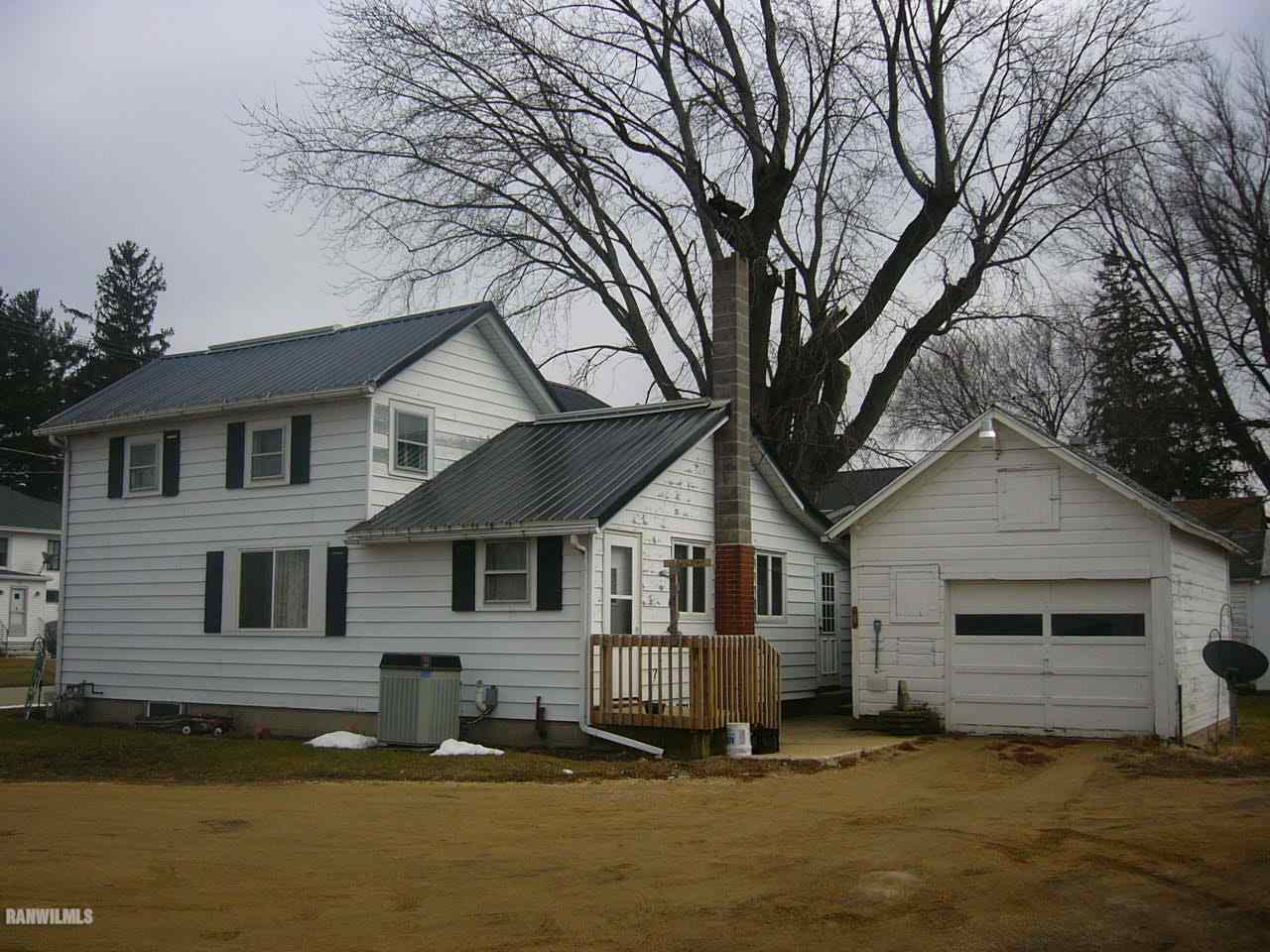 682 North Kent Road Kent, IL 61044 - Photo 12 of 13 a front view of a house with a yard