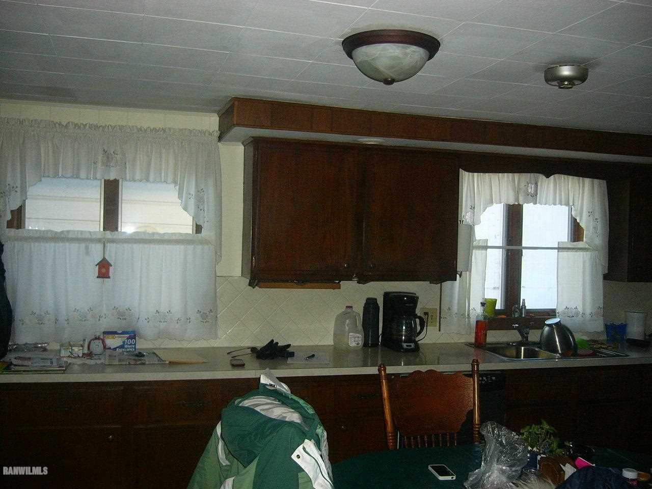 682 North Kent Road Kent, IL 61044 - Photo 2 of 13 a kitchen with a sink cabinets and window