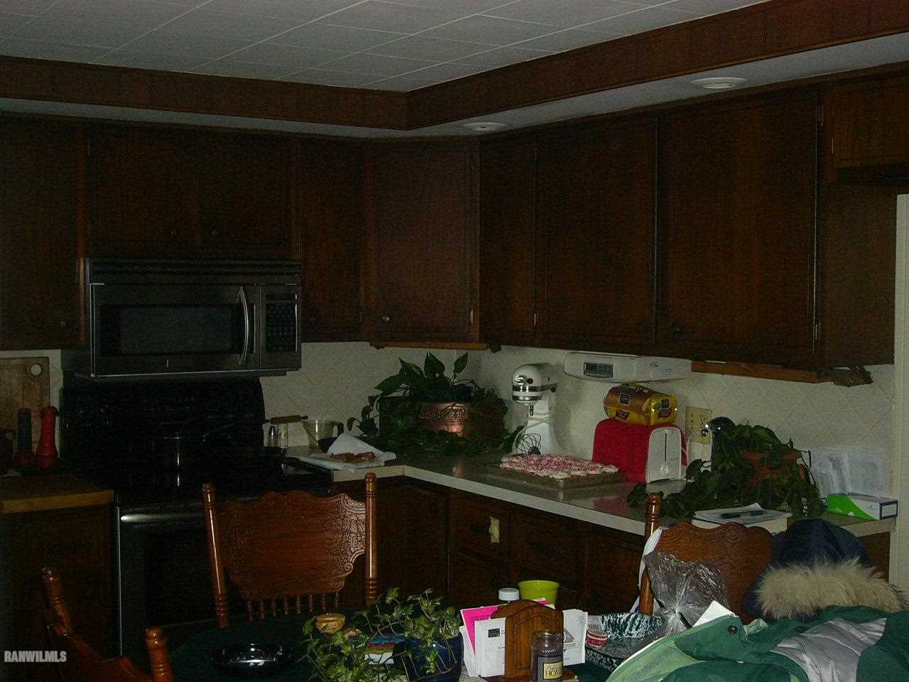 682 North Kent Road Kent, IL 61044 - Photo 3 of 13 a kitchen with a cabinets and appliances