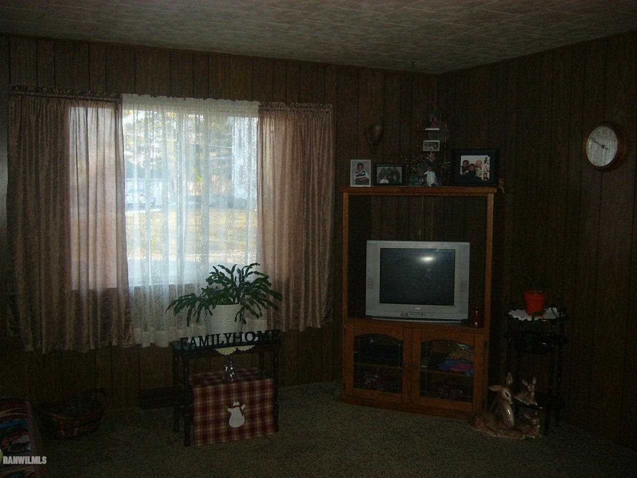 682 North Kent Road Kent, IL 61044 - Photo 4 of 13 a living room with furniture and a flat screen tv