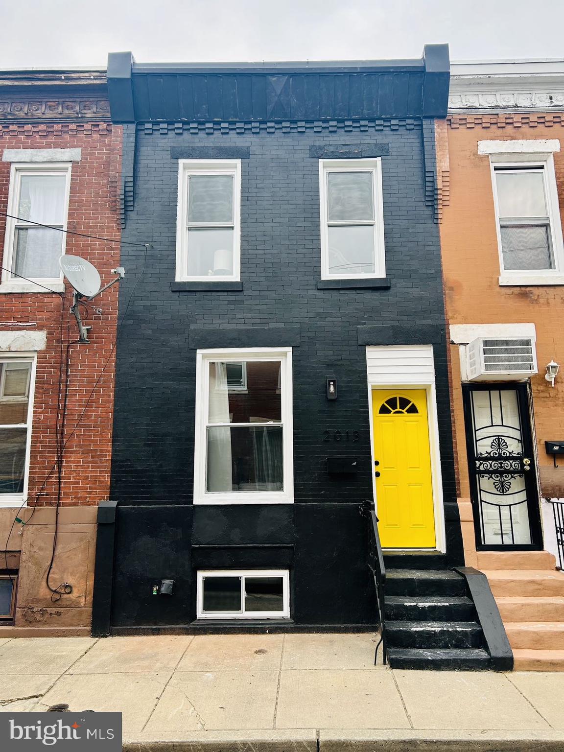 2013 South Bouvier Street Philadelphia, PA 19145 - Photo 1 of 18 a front view of a multi story residential apartment building