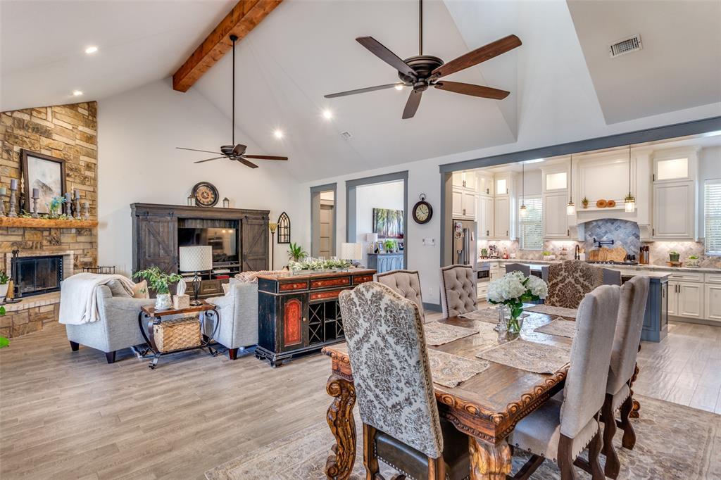 216 Deer Glade Court Azle, TX 76020 - Photo 13 of 40 a view of a dining room with furniture window and wooden floor