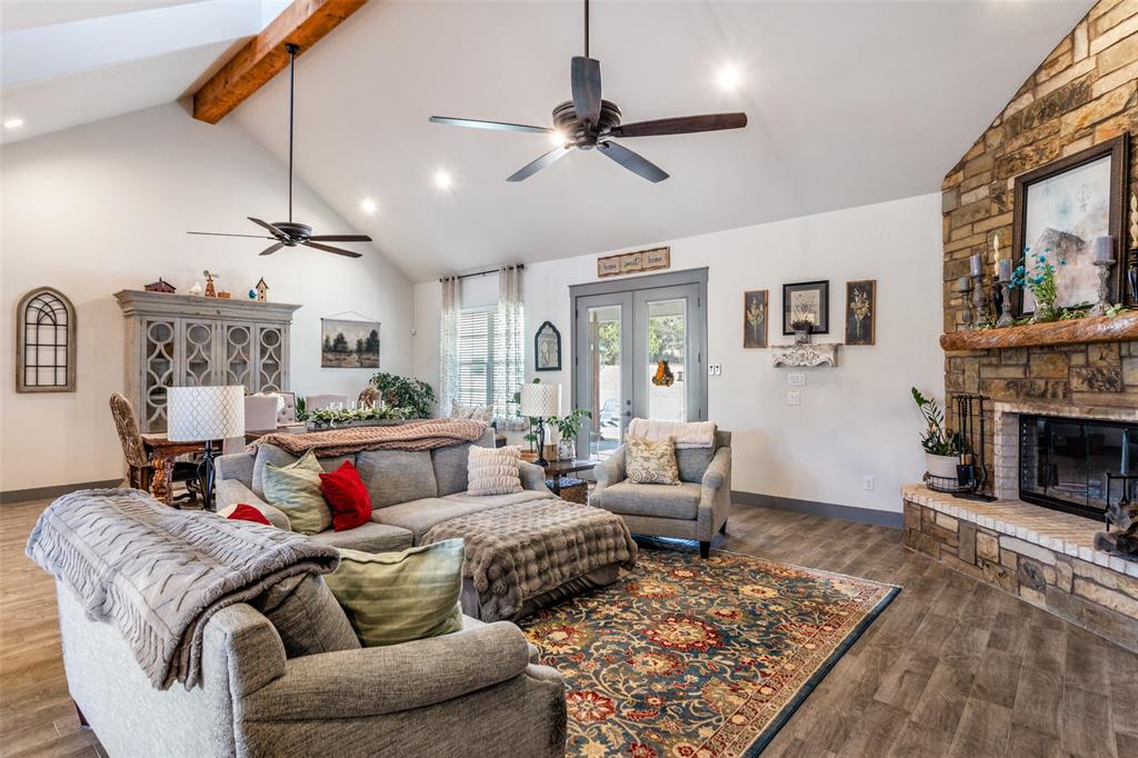 216 Deer Glade Court Azle, TX 76020 - Photo 15 of 40 a living room with furniture and a fireplace