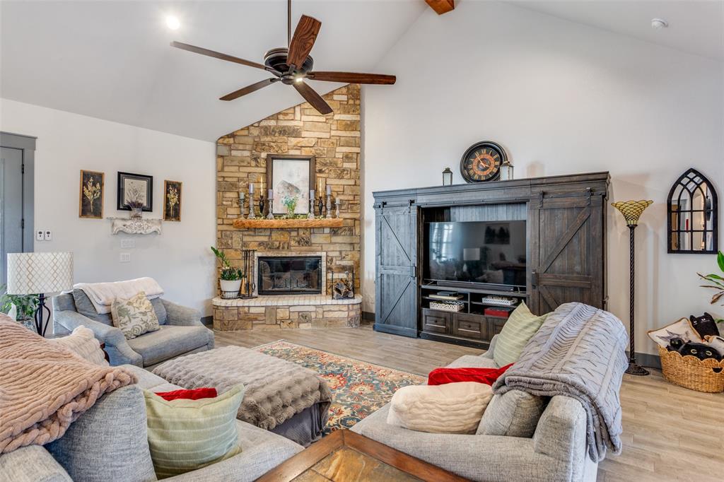 216 Deer Glade Court Azle, TX 76020 - Photo 16 of 40 a living room with furniture fireplace and flat screen tv