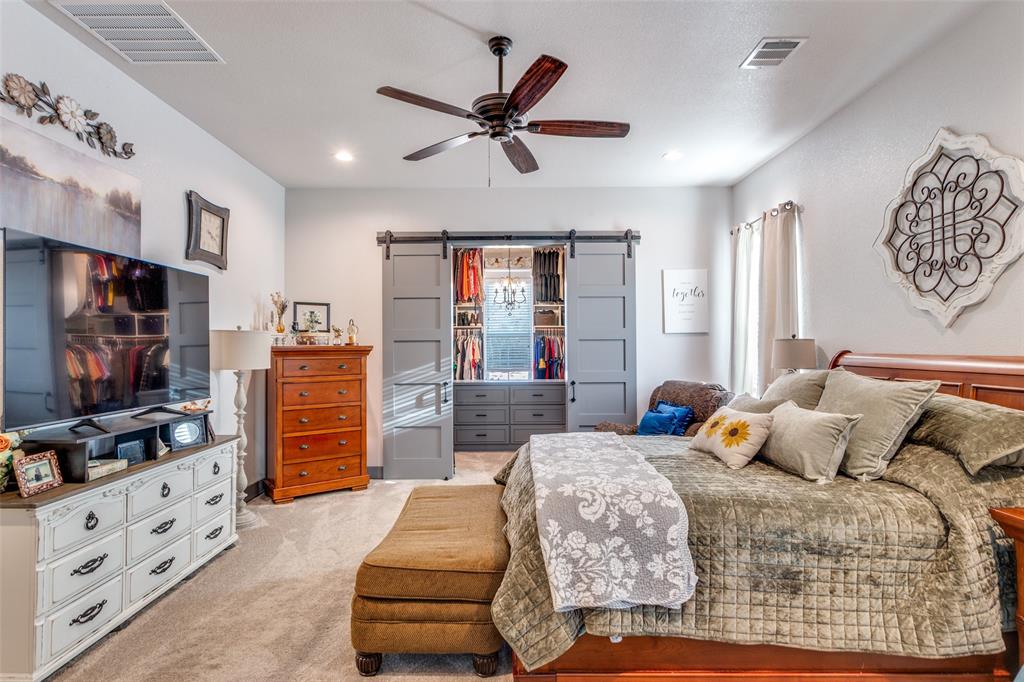 216 Deer Glade Court Azle, TX 76020 - Photo 18 of 40 a bedroom with furniture and window
