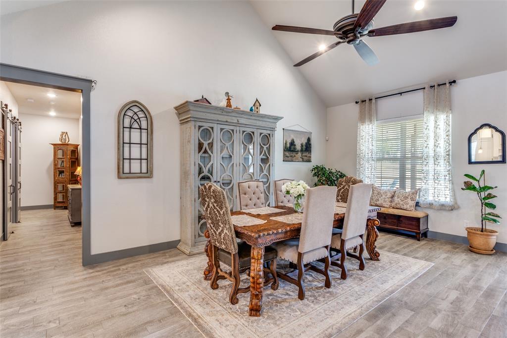 216 Deer Glade Court Azle, TX 76020 - Photo 23 of 40 a view of a dining room with furniture window and wooden floor