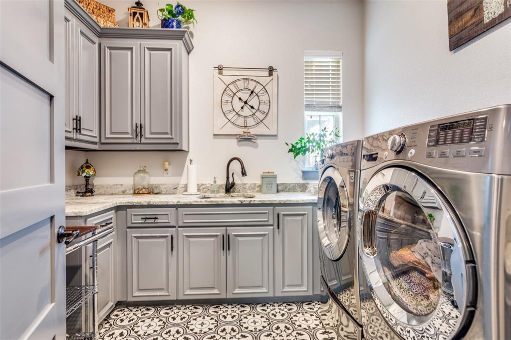 216 Deer Glade Court Azle, TX 76020 - Photo 29 of 40 a kitchen with granite countertop a sink and a stove
