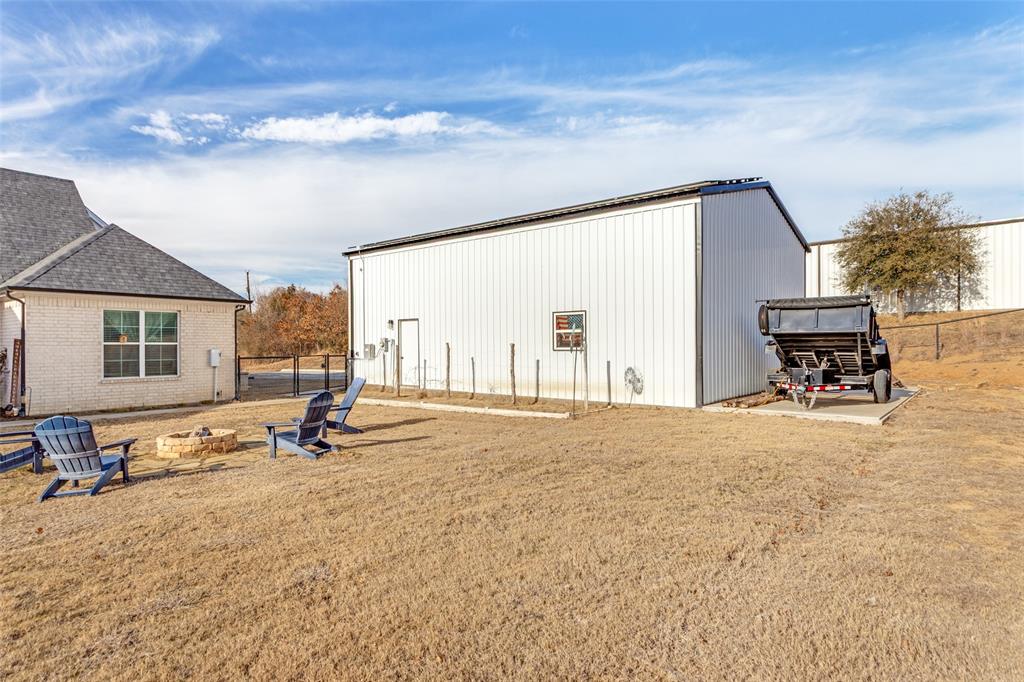 216 Deer Glade Court Azle, TX 76020 - Photo 37 of 40 a view of a house with backyard and sitting area