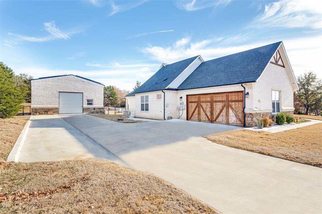 216 Deer Glade Court Azle, TX 76020 - Photo 4 of 40 a view of large house with a outdoor space