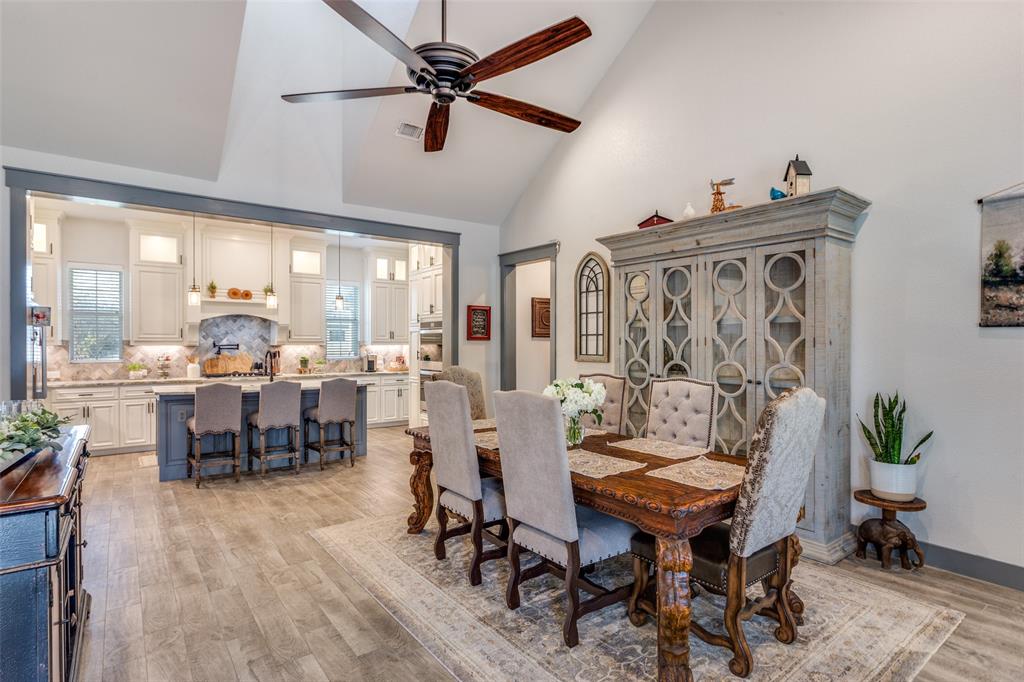 216 Deer Glade Court Azle, TX 76020 - Photo 7 of 40 a view of a dining room with furniture window and wooden floor