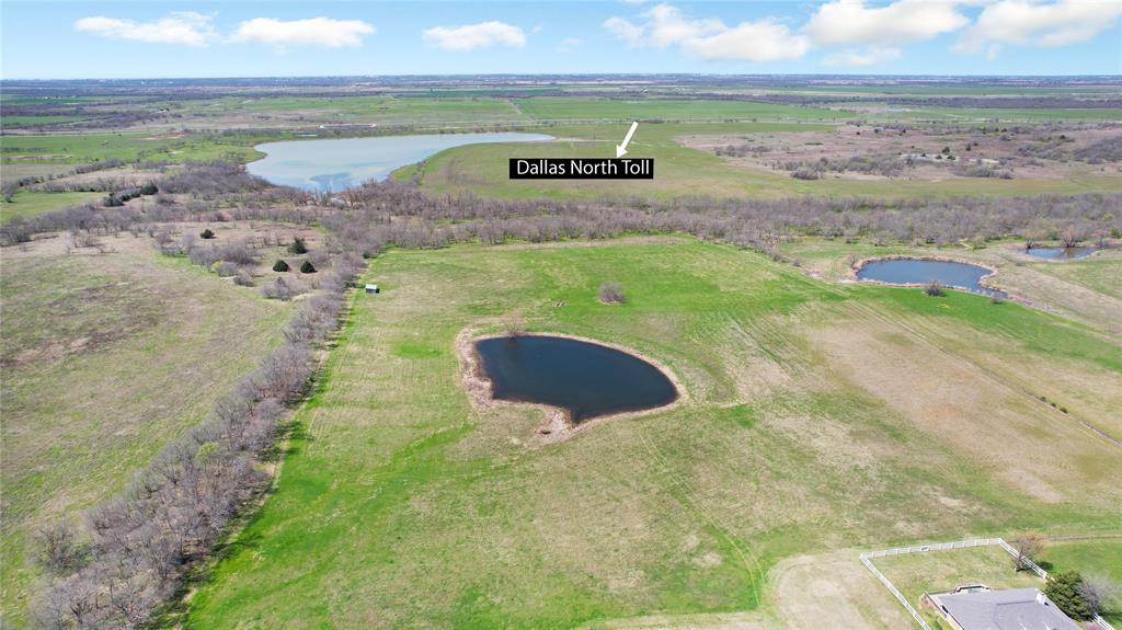 a view of a lake with a big yard