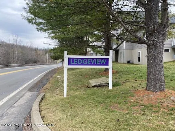 a sign that is on the side of the road