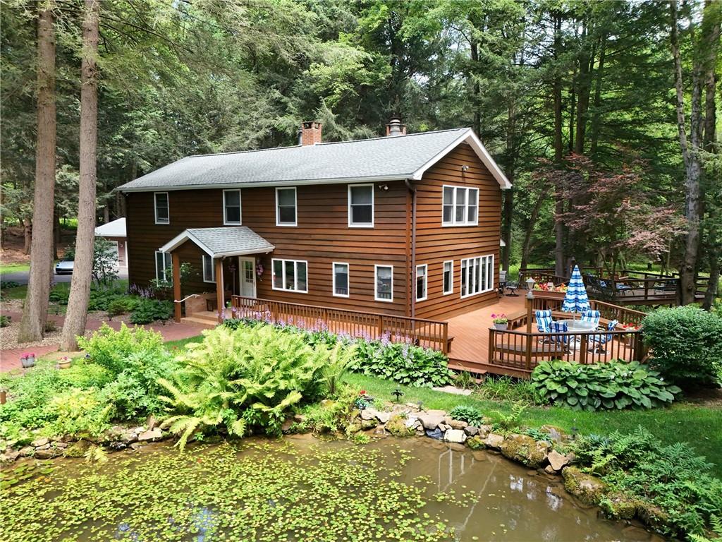 a front view of a house with a yard table and chairs