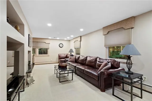 a view of a house with backyard sitting area and wooden floor