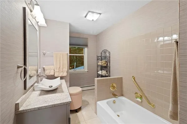 a view of outdoor sitting area with furniture and wooden floor