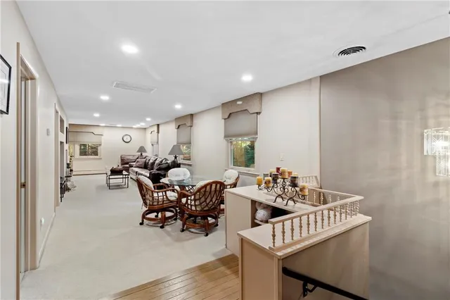 a view of a dinning table and chairs in the balcony
