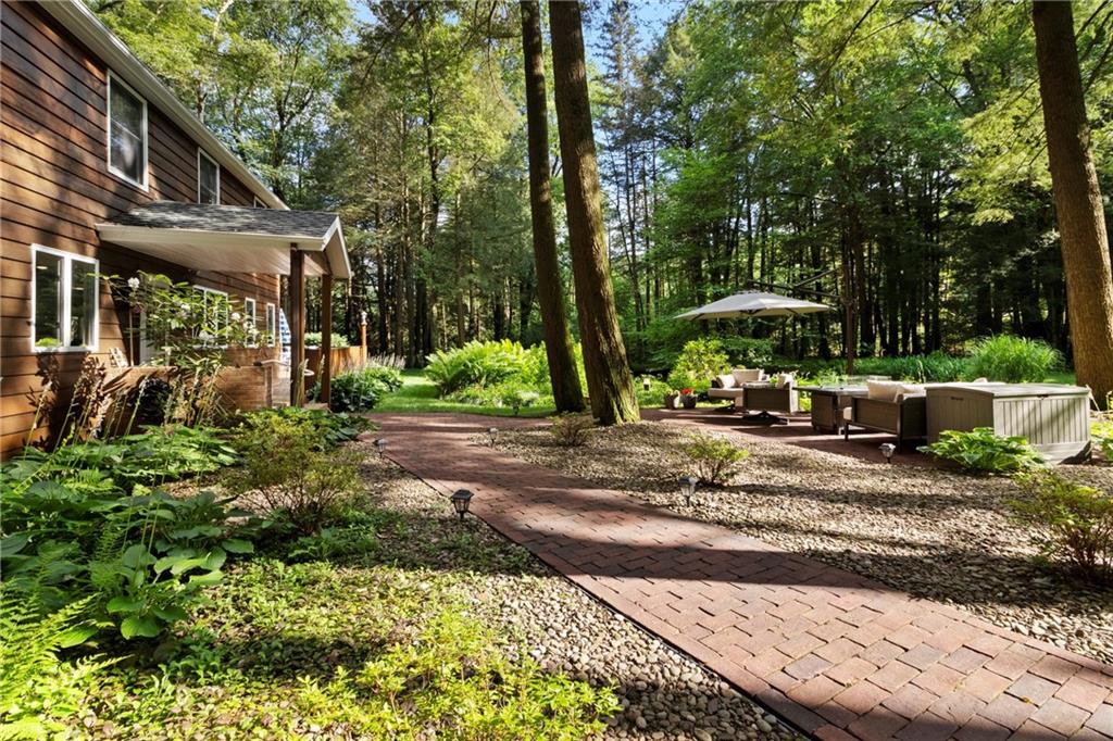 0 Rockton Rockton, PA 15856 - Photo 32 of 50 a view of a patio with table and chairs under an umbrella with large trees