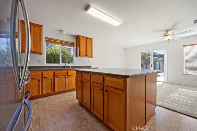 a view of a kitchen with a sink and a window
