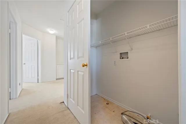 a bathroom with a double vanity sink toilet and shower