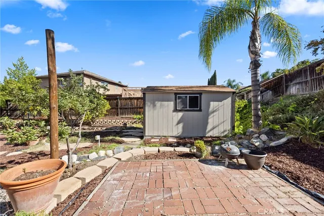 a view of a backyard with sitting area