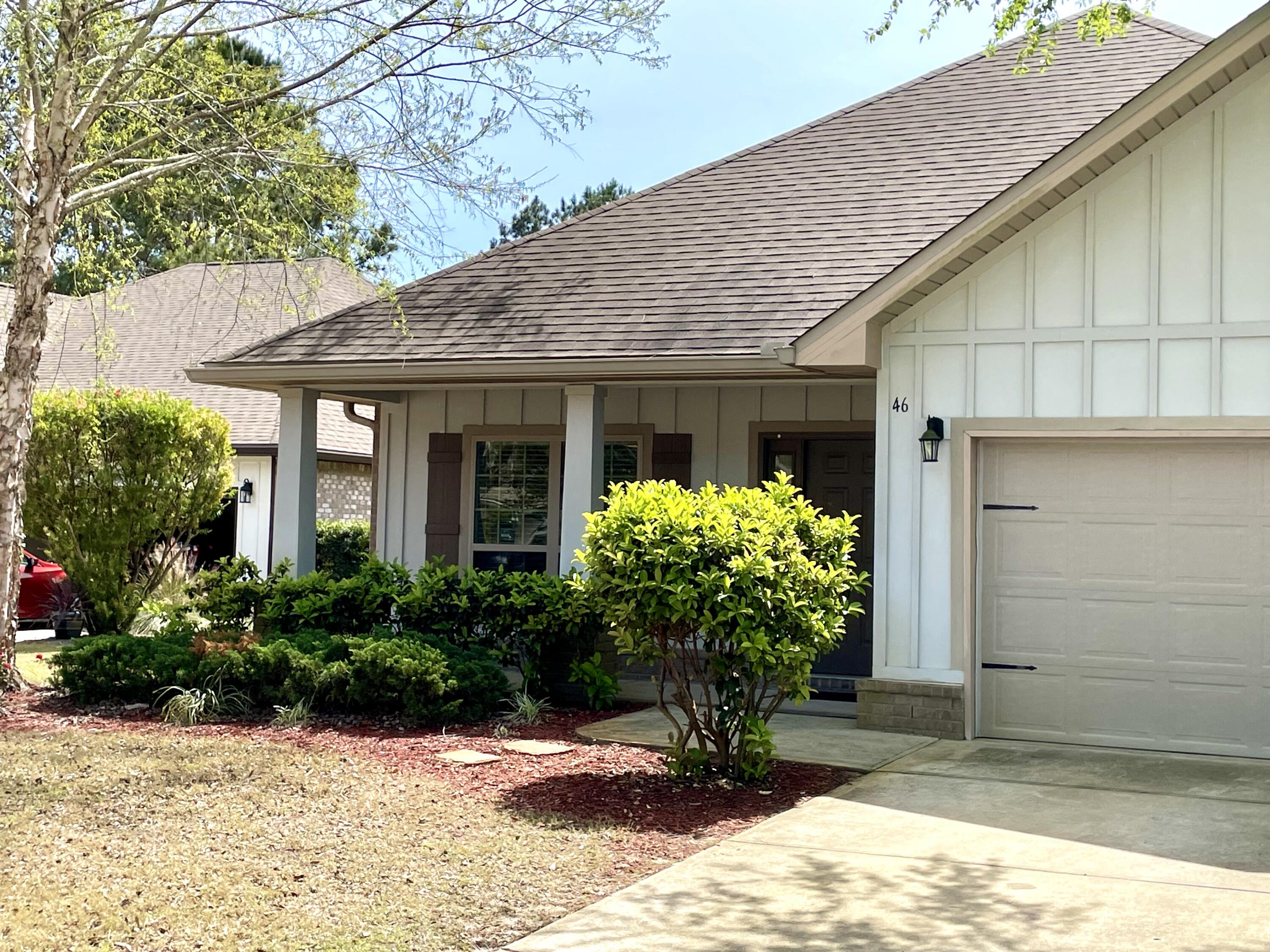 46 Hemingway Lane Freeport, FL 32439 - Photo 15 of 27 a front view of a house having yard