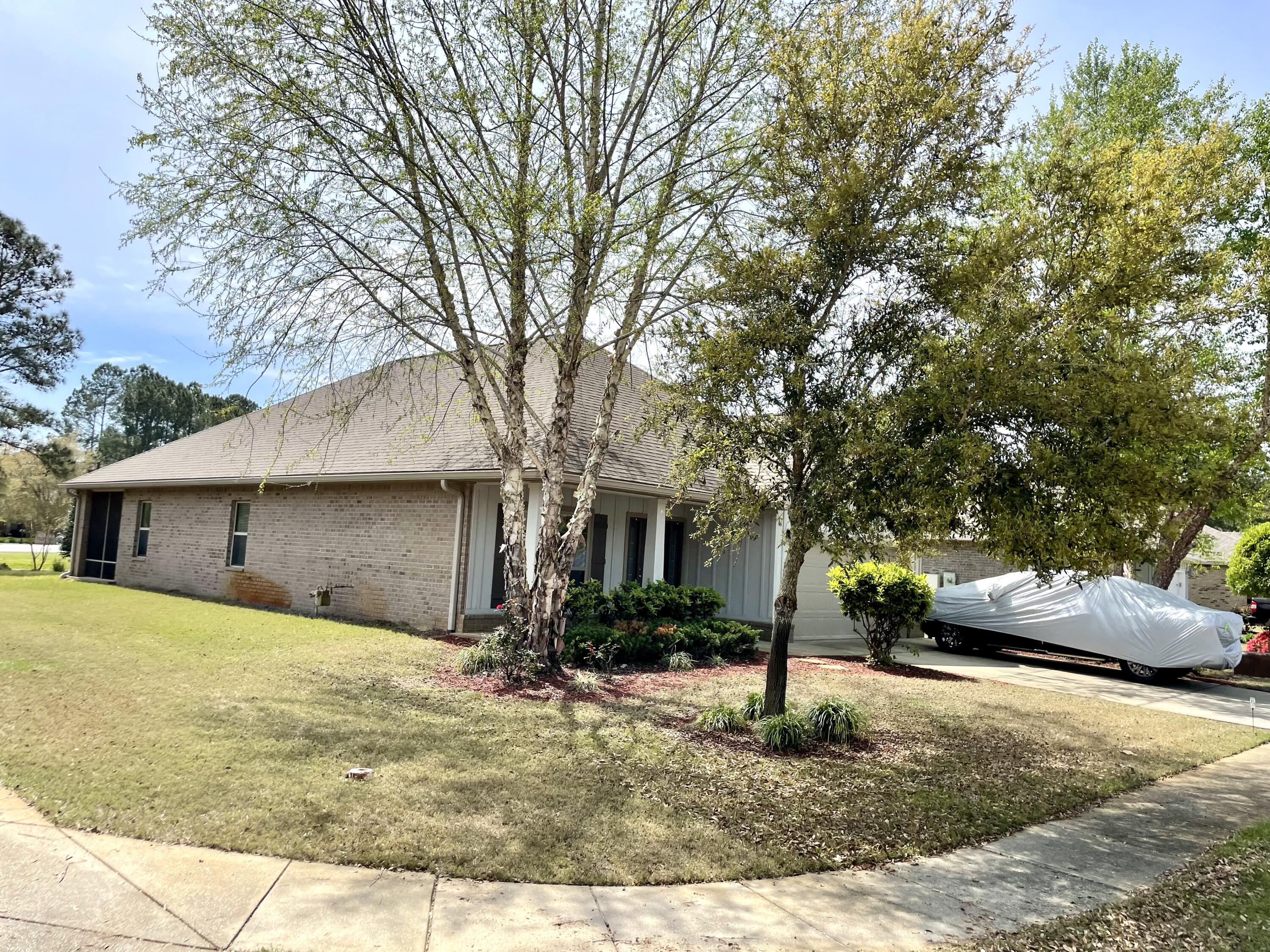 46 Hemingway Lane Freeport, FL 32439 - Photo 16 of 27 a front view of a house with garden