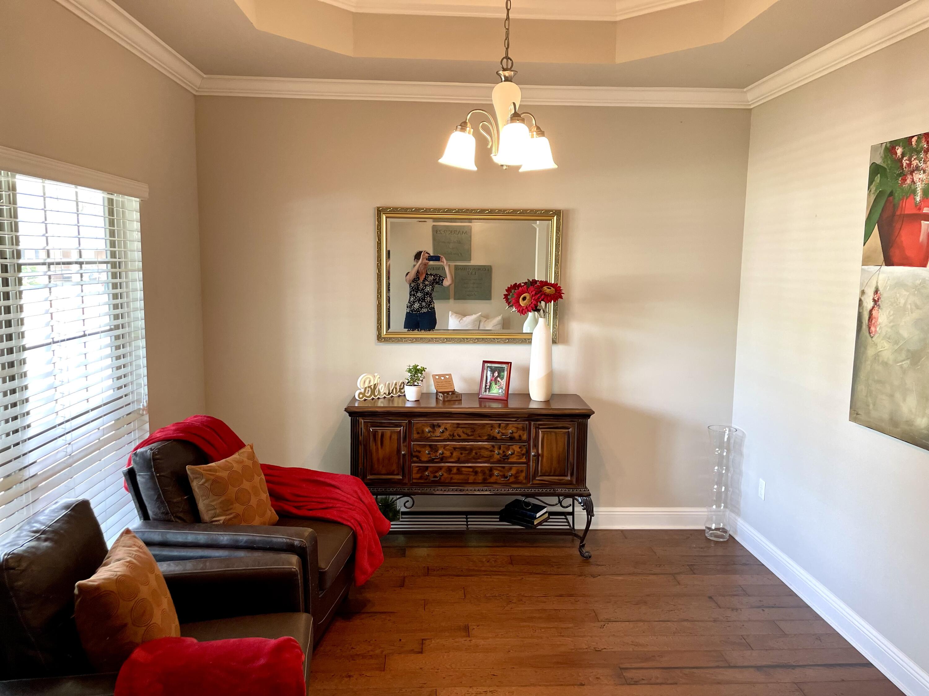 46 Hemingway Lane Freeport, FL 32439 - Photo 18 of 27 a bed room with furniture and a chandelier