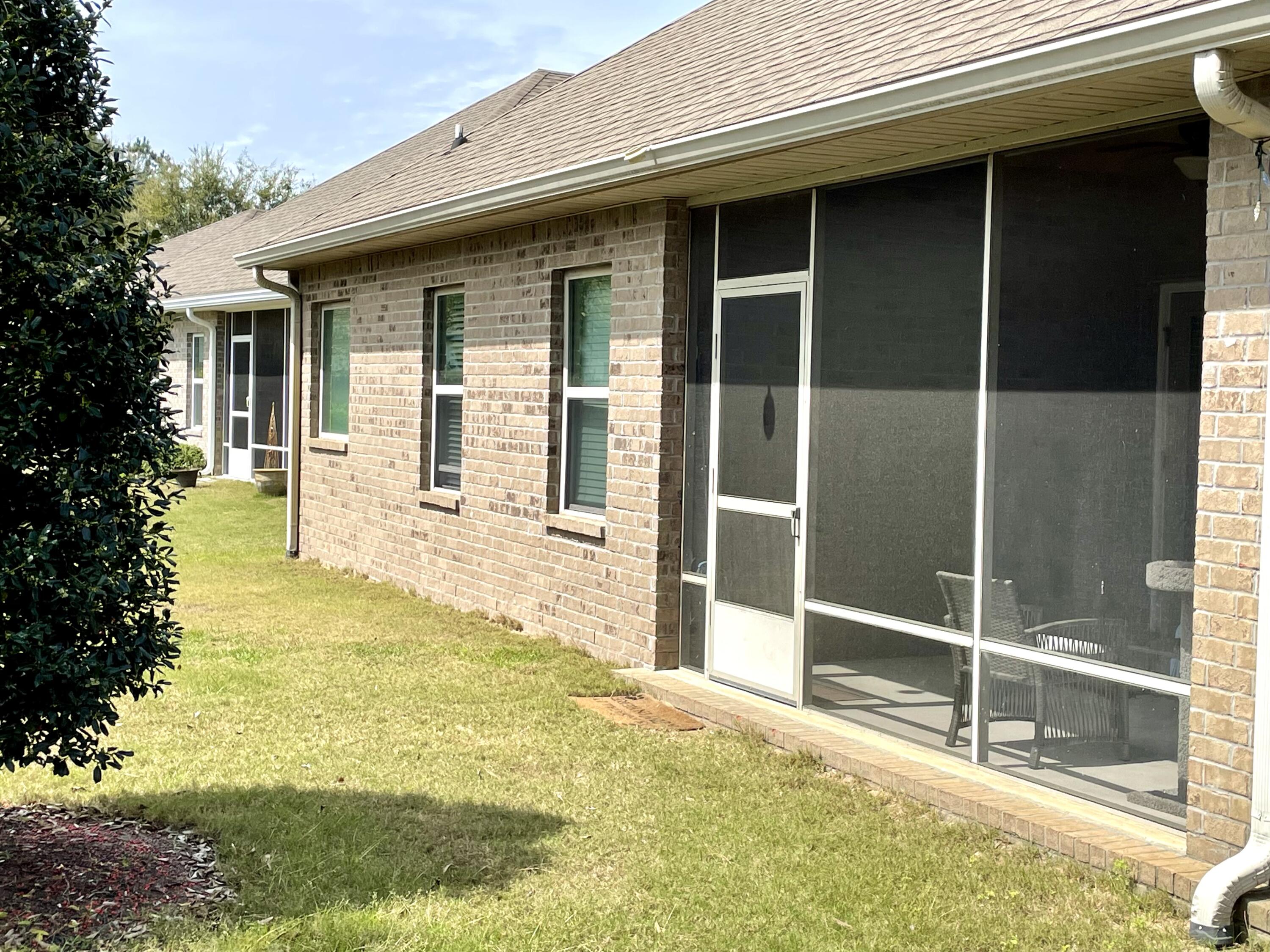 46 Hemingway Lane Freeport, FL 32439 - Photo 6 of 27 a house with yard in front of it