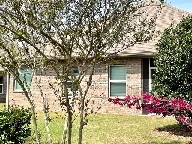 a view of house with yard