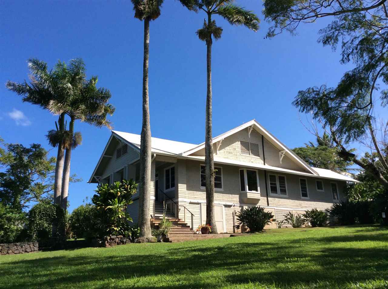 1061 Kokomo Road Haiku, HI 96708 - Photo 1 of 30 a front view of a house with a yard