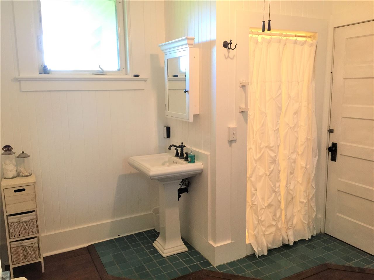 1061 Kokomo Road Haiku, HI 96708 - Photo 11 of 30 a bathroom with a sink and shower