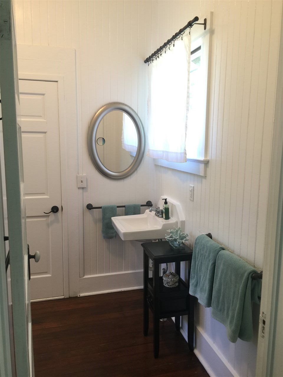 1061 Kokomo Road Haiku, HI 96708 - Photo 14 of 30 a bathroom with a sink a toilet and a mirror