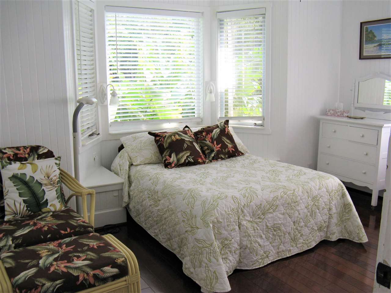 1061 Kokomo Road Haiku, HI 96708 - Photo 15 of 30 a bedroom with a bed and a window