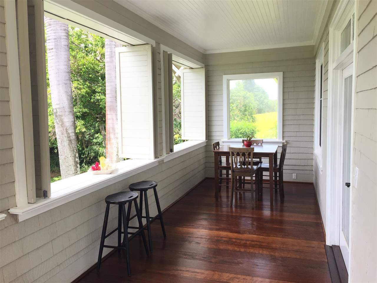 1061 Kokomo Road Haiku, HI 96708 - Photo 17 of 30 a view of a dining room with furniture and windows