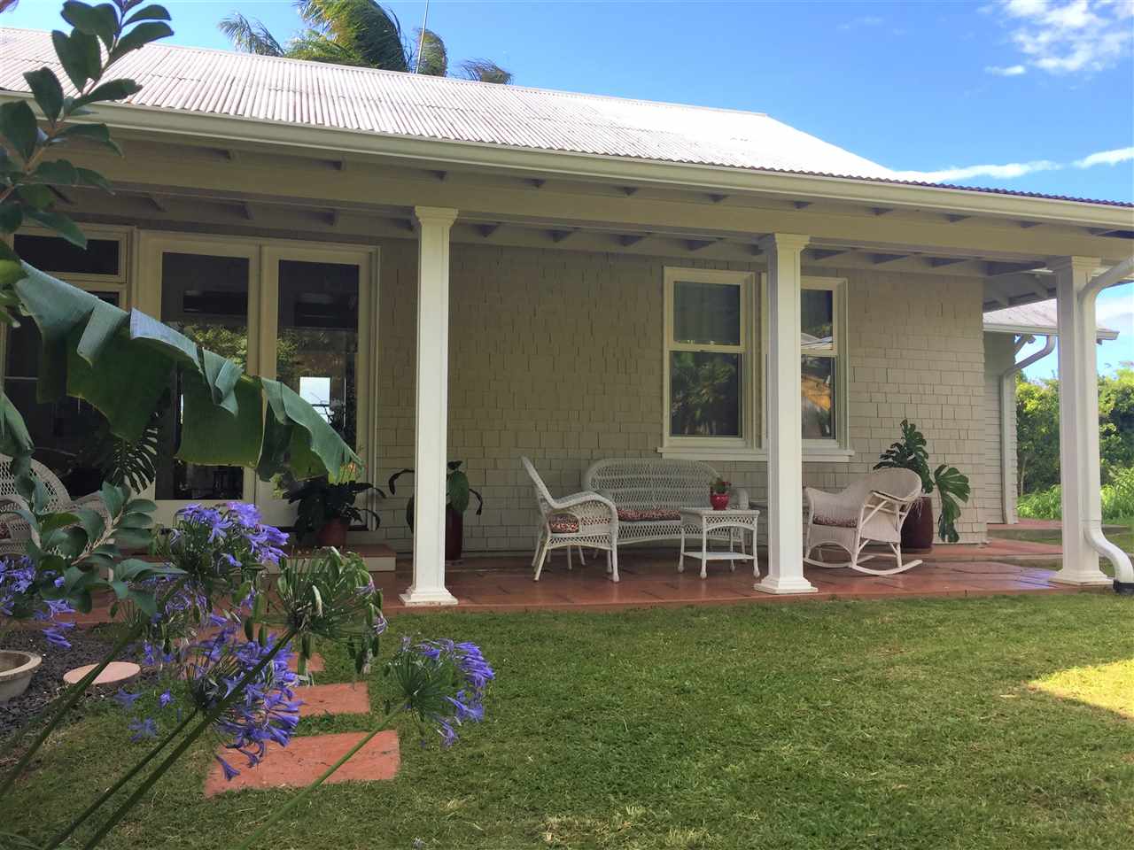 1061 Kokomo Road Haiku, HI 96708 - Photo 2 of 30 front view of a house with a yard
