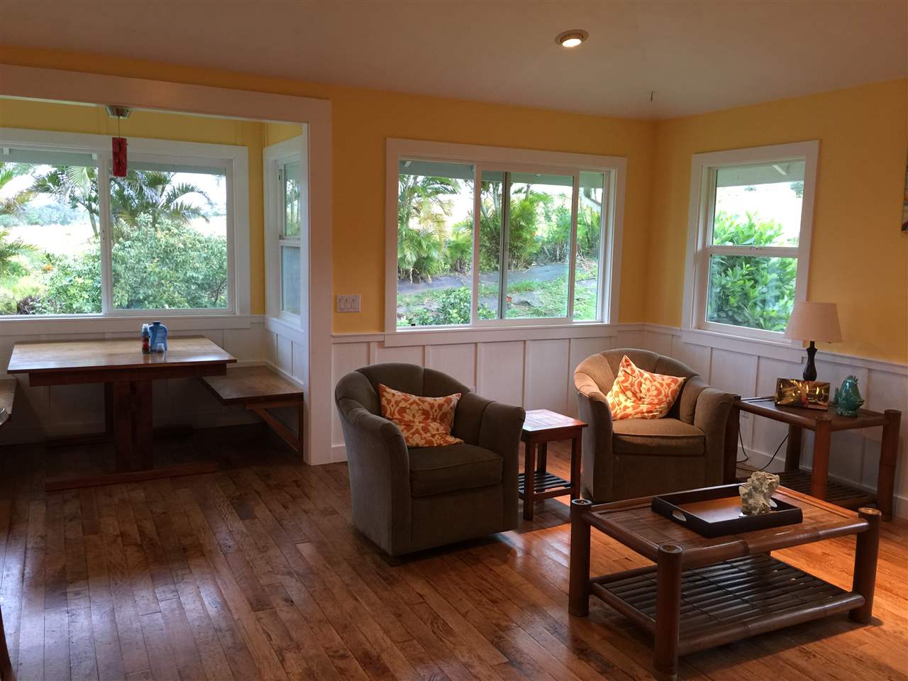 1061 Kokomo Road Haiku, HI 96708 - Photo 23 of 30 a living room with furniture and a large window