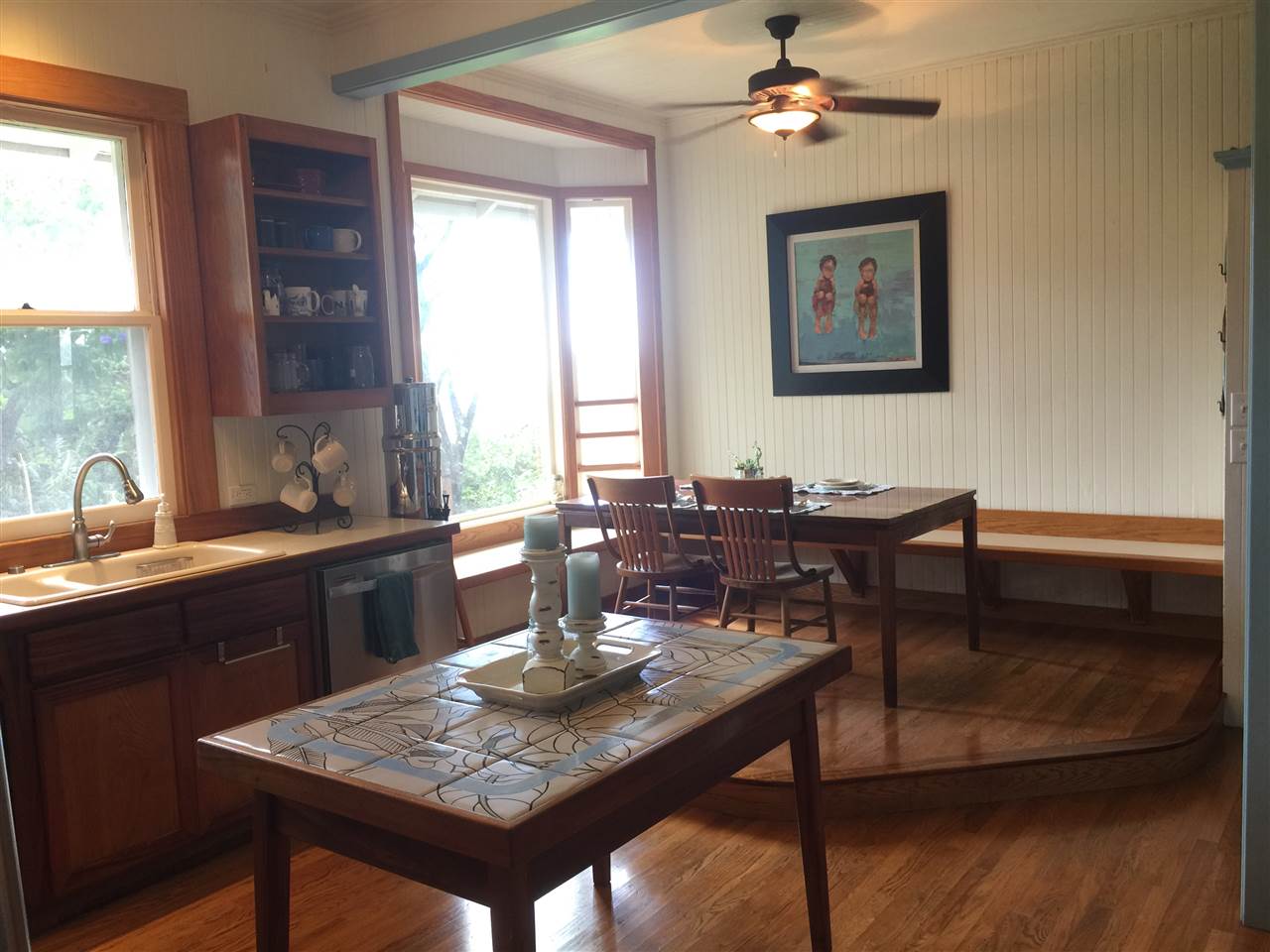 1061 Kokomo Road Haiku, HI 96708 - Photo 4 of 30 a view of a dining room with furniture window and wooden floor