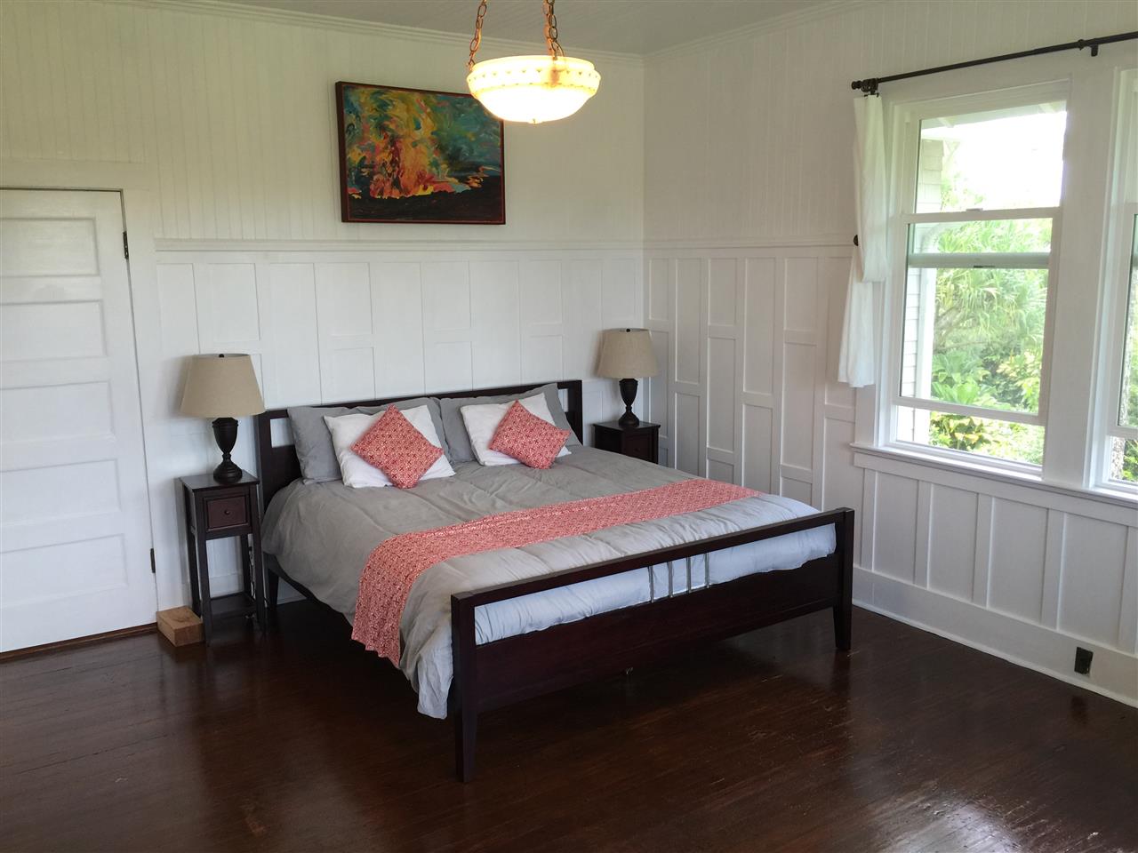 1061 Kokomo Road Haiku, HI 96708 - Photo 9 of 30 a bedroom with a bed and a window