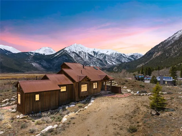 a view of a balcony with furniture and a floor to ceiling window