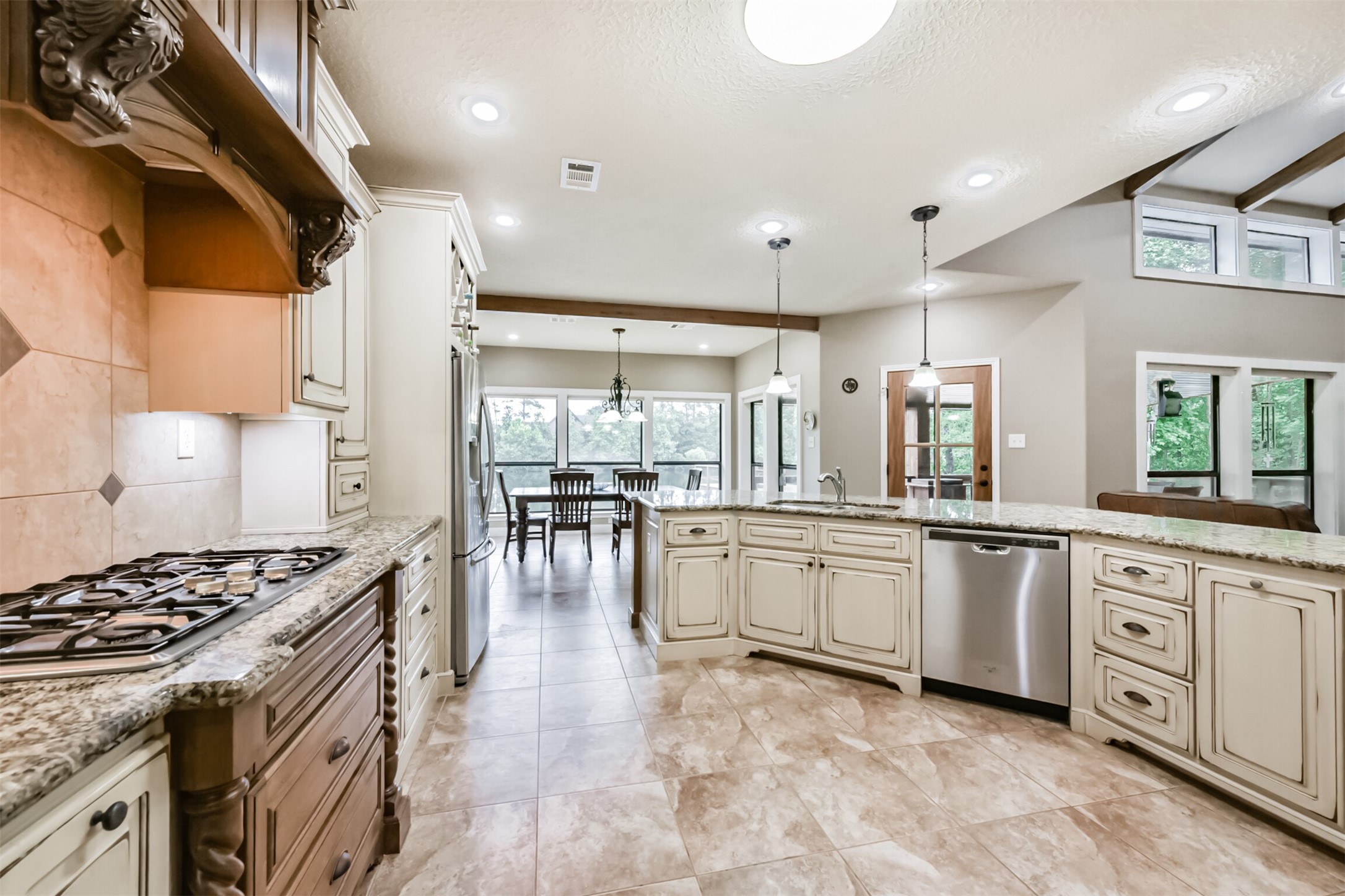 46 Deer Ridge Cleveland, TX 77327 - Photo 12 of 40 a kitchen with white cabinets and appliances