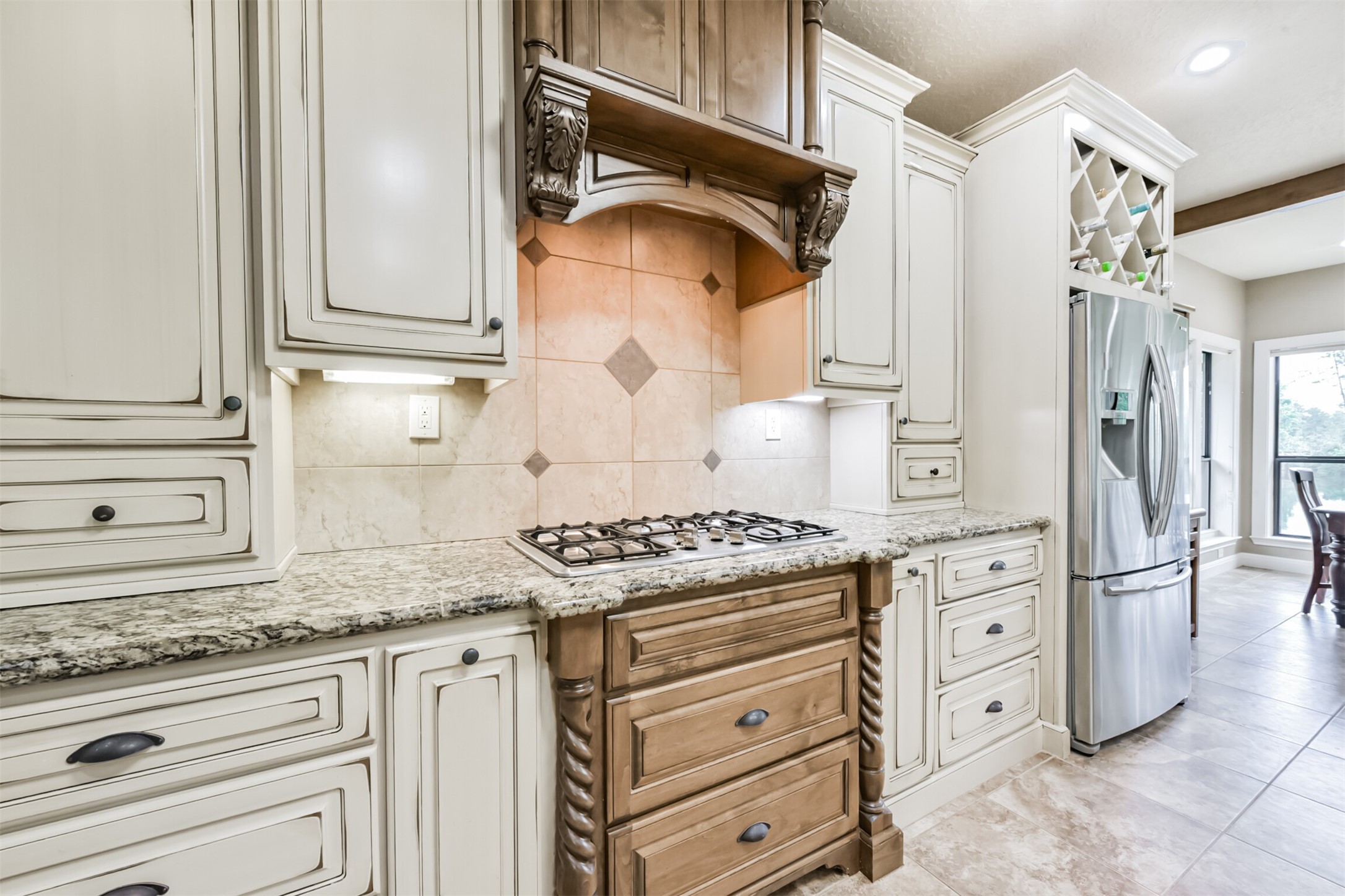 46 Deer Ridge Cleveland, TX 77327 - Photo 14 of 40 a kitchen with granite countertop white cabinets and white appliances