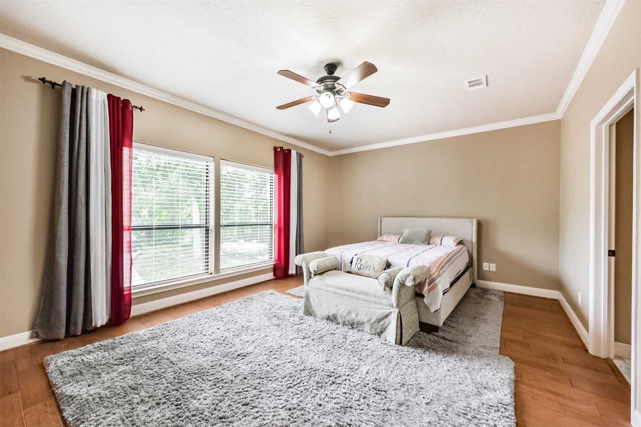 46 Deer Ridge Cleveland, TX 77327 - Photo 17 of 40 a bed sitting in a spacious bedroom next to a window