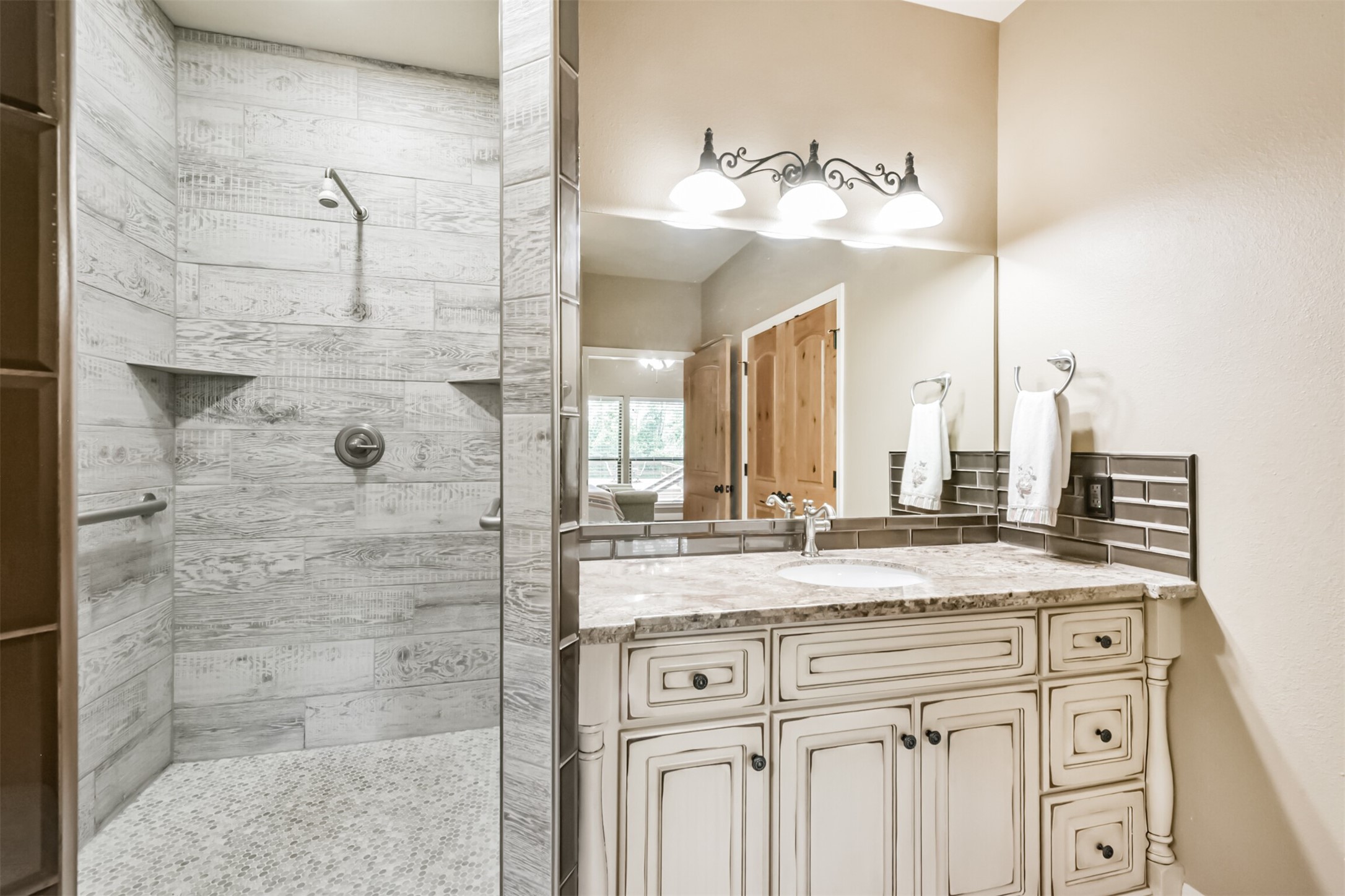 46 Deer Ridge Cleveland, TX 77327 - Photo 21 of 40 a bathroom with a sink vanity and a mirror