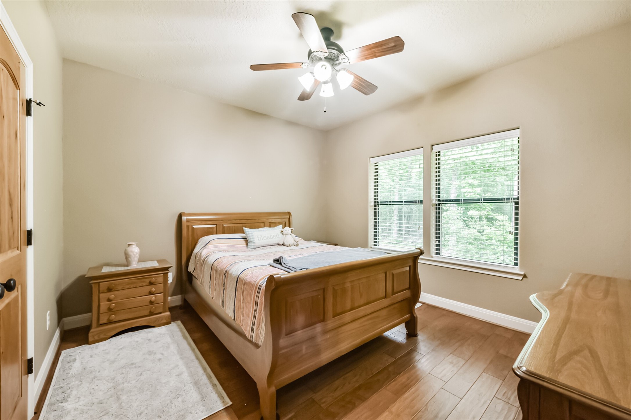 46 Deer Ridge Cleveland, TX 77327 - Photo 22 of 40 a bed sitting in a bedroom next to a window