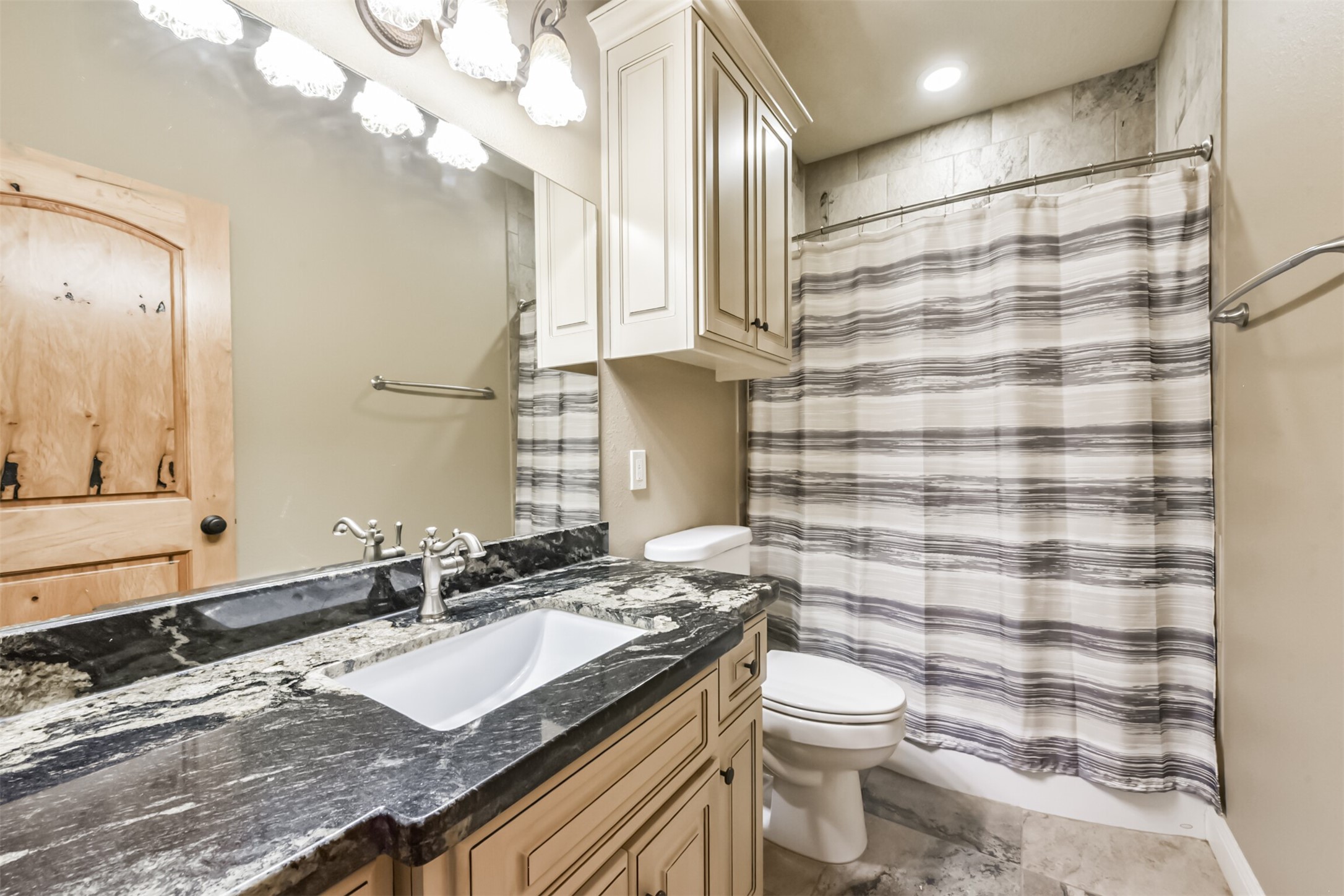 46 Deer Ridge Cleveland, TX 77327 - Photo 23 of 40 a bathroom with a granite countertop bathtub sink vanity mirror and toilet